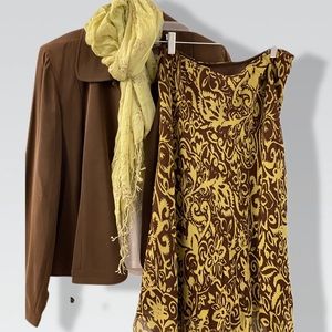 Jamie’s Contemporary Clothing 100% silk lining 100% polyester outside.